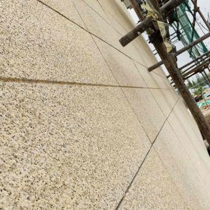 铜仁 黄金麻花岗岩荔枝面外墙干挂石材效果示例